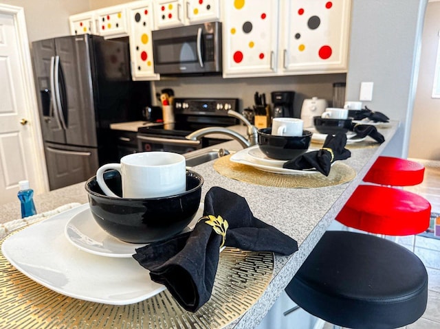 2807 Playing Otter Ct, Kissimmee, FL 34747 - kitchen with stainless steel appliances and white cabinets