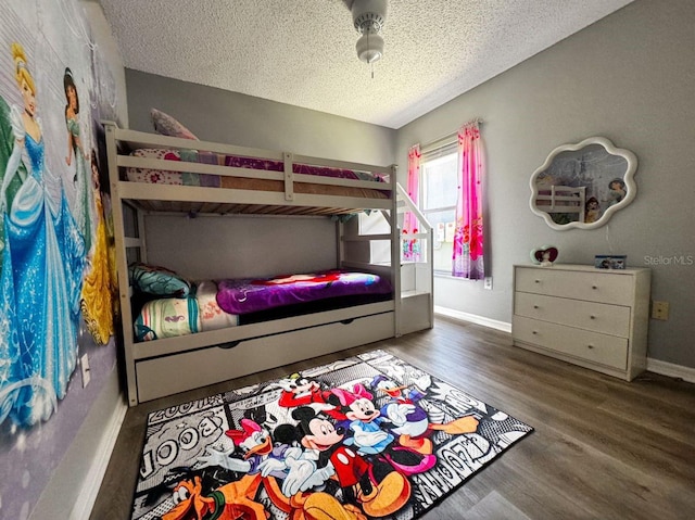 2807 Playing Otter Ct, Kissimmee, FL 34747 - bedroom with a textured ceiling and wood finished floors