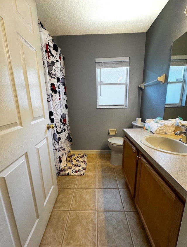 2807 Playing Otter Ct, Kissimmee, FL 34747 - full bathroom with vanity, tile patterned flooring, a textured ceiling, and curtained shower
