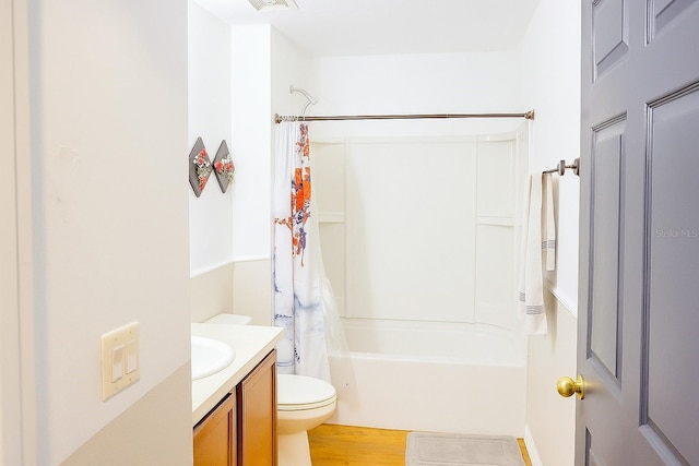 423 Midway Ave, Mascotte, FL 34753 - bathroom featuring vanity, shower / bath combination with curtain, and wood finished floors