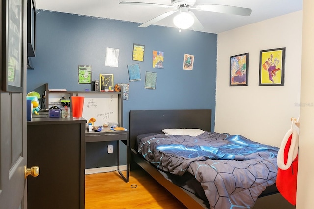 423 Midway Ave, Mascotte, FL 34753 - bedroom with wood finished floors and ceiling fan