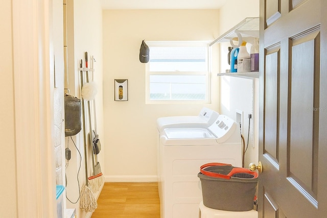 423 Midway Ave, Mascotte, FL 34753 - washroom with separate washer and dryer and light wood-style floors