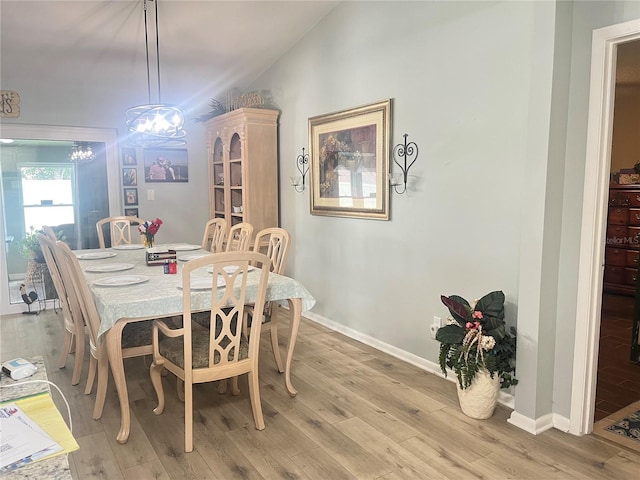 421 Bridle Path, Casselberry, FL 32707 - dining area featuring light wood-type flooring and a chandelier