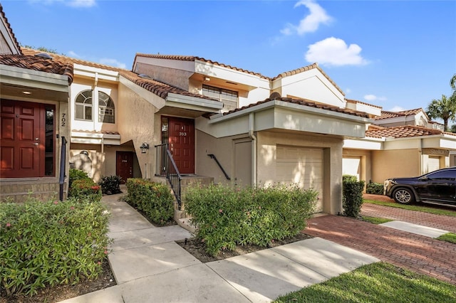17340 Boca Club Blvd Unit 703, Boca Raton, FL 33487 - multi unit property with a garage, stucco siding, and a tile roof