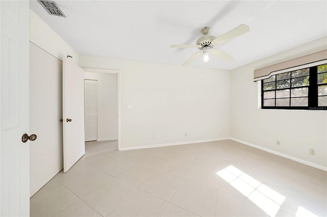 17340 Boca Club Blvd Unit 703, Boca Raton, FL 33487 - unfurnished bedroom with ceiling fan and light tile patterned floors