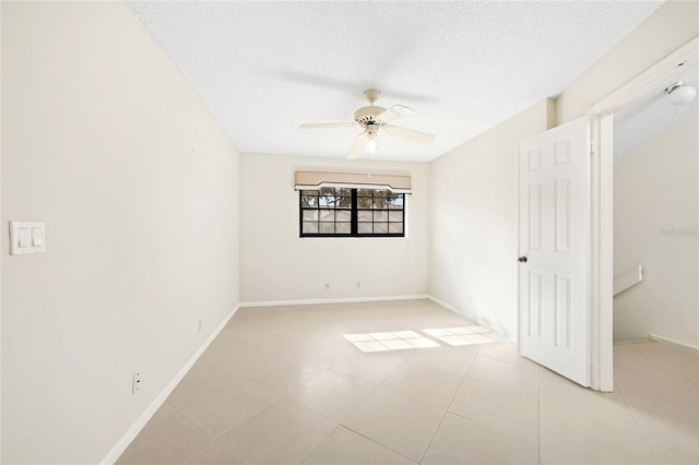 17340 Boca Club Blvd Unit 703, Boca Raton, FL 33487 - unfurnished bedroom with a textured ceiling, a ceiling fan, and light tile patterned floors