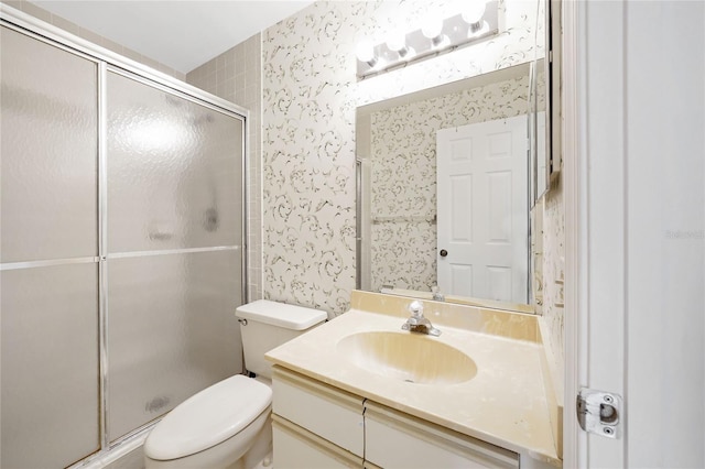 17340 Boca Club Blvd Unit 703, Boca Raton, FL 33487 - bathroom featuring wallpapered walls, a shower stall, and vanity