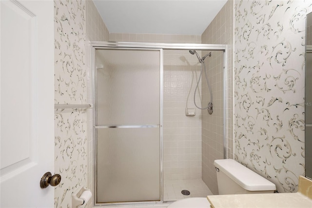 17340 Boca Club Blvd Unit 703, Boca Raton, FL 33487 - bathroom featuring wallpapered walls, a shower stall, and vanity