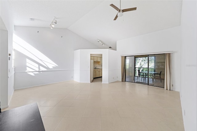 17340 Boca Club Blvd Unit 703, Boca Raton, FL 33487 - empty room with track lighting, high vaulted ceiling, a ceiling fan, and light tile patterned floors