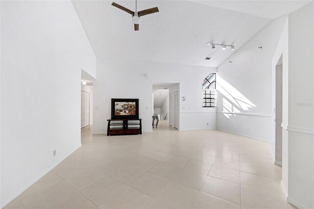 17340 Boca Club Blvd Unit 703, Boca Raton, FL 33487 - unfurnished living room with ceiling fan, light tile patterned floors, and rail lighting
