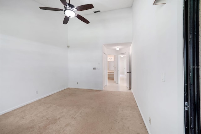 17340 Boca Club Blvd Unit 703, Boca Raton, FL 33487 - carpeted empty room with ceiling fan and a towering ceiling