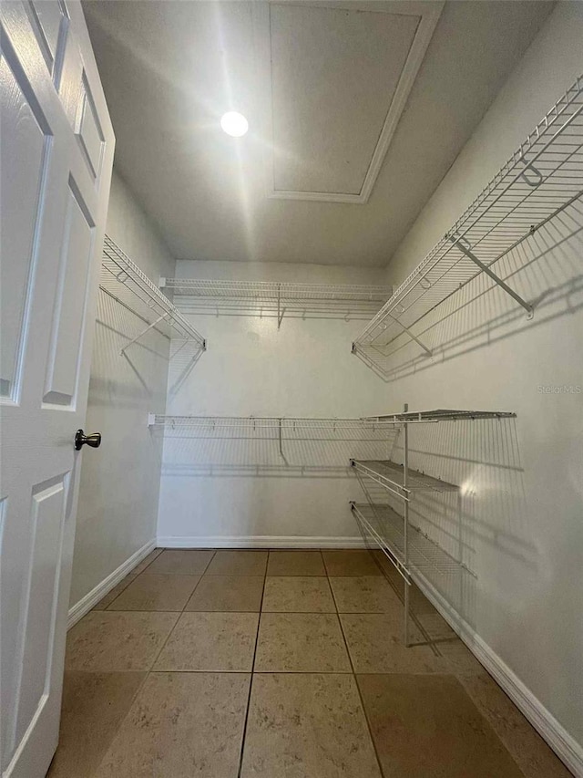 343 Marquee Dr, Kissimmee, FL 34758 - spacious closet featuring tile patterned floors