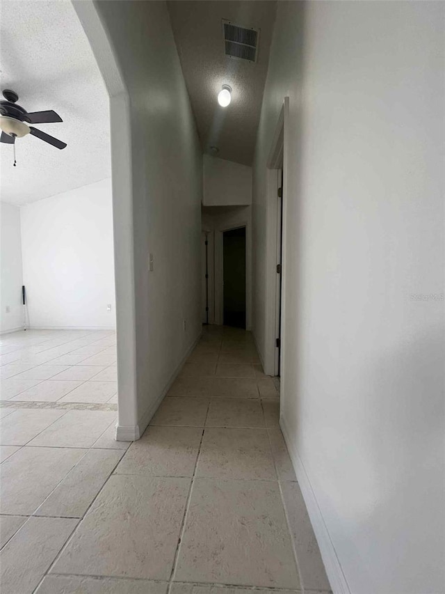 343 Marquee Dr, Kissimmee, FL 34758 - corridor with a textured ceiling and arched walkways