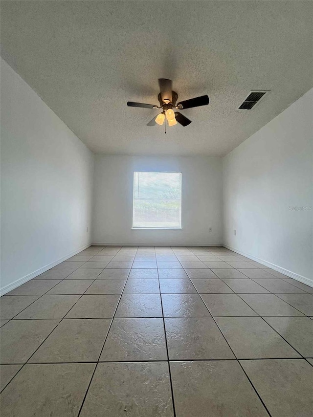 343 Marquee Dr, Kissimmee, FL 34758 - unfurnished room featuring a textured ceiling, light tile patterned floors, and a ceiling fan
