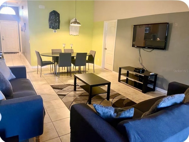 2281 Royal Ridge Dr, Davenport, FL 33896 - living room featuring light tile patterned floors and baseboards
