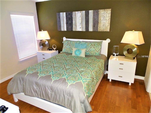 2281 Royal Ridge Dr, Davenport, FL 33896 - bedroom with wood finished floors