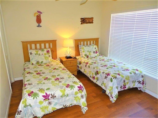 2281 Royal Ridge Dr, Davenport, FL 33896 - bedroom featuring dark wood-style floors