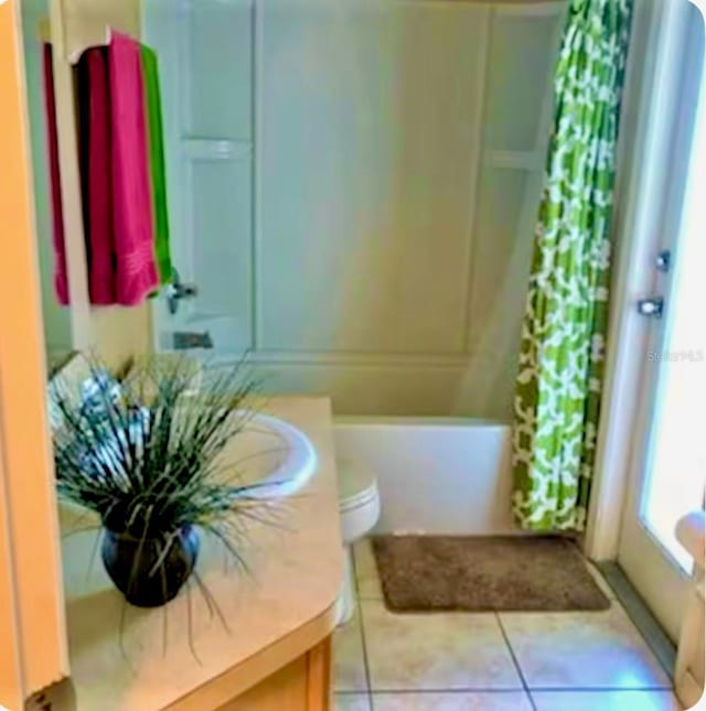 2281 Royal Ridge Dr, Davenport, FL 33896 - full bath with vanity, tile patterned floors, and shower / bath combination with curtain