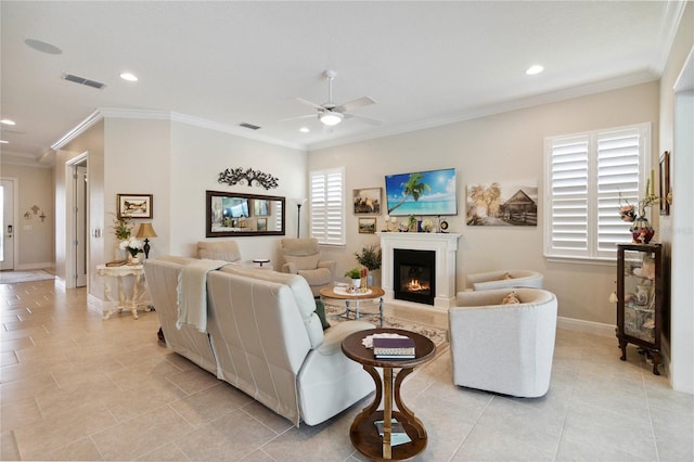 2772 Southland St, Saint Cloud, FL 34772 - living area featuring a ceiling fan, recessed lighting, a warm lit fireplace, light tile patterned flooring, and crown molding