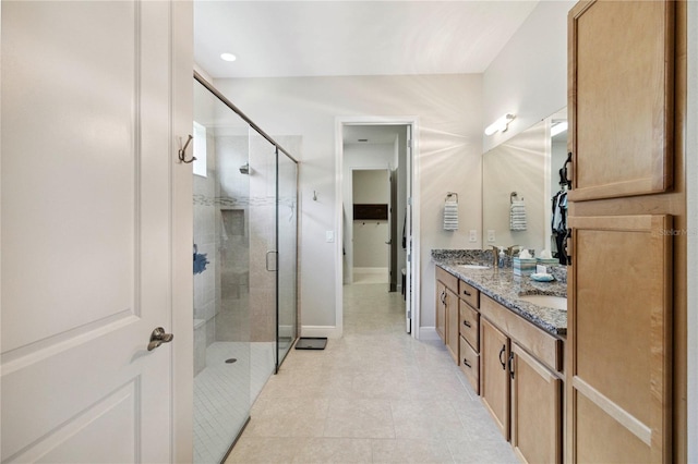 2772 Southland St, Saint Cloud, FL 34772 - bathroom featuring double vanity, a shower stall, and tile patterned flooring