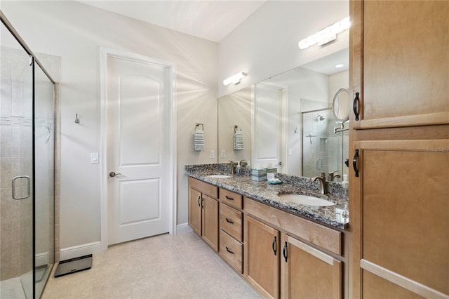 2772 Southland St, Saint Cloud, FL 34772 - bathroom featuring a stall shower, double vanity, and tile patterned floors