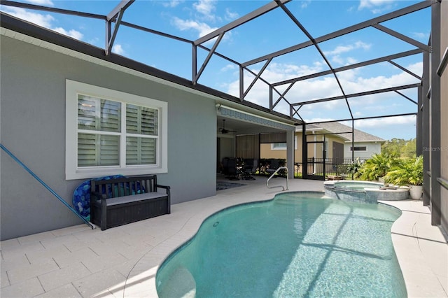 2772 Southland St, Saint Cloud, FL 34772 - view of swimming pool featuring a patio, a ceiling fan, a pool with connected hot tub, and glass enclosure