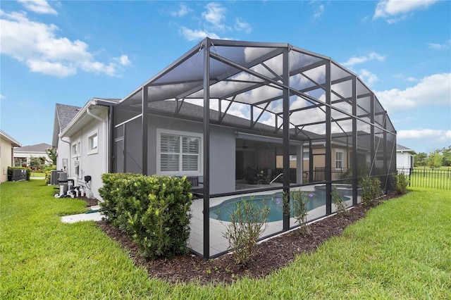 2772 Southland St, Saint Cloud, FL 34772 - back of house with stucco siding, a patio, and a lanai