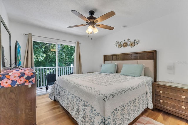 1129 Park Ridge Cir, Kissimmee, FL 34746 - bedroom with access to exterior, light wood finished floors, and ceiling fan