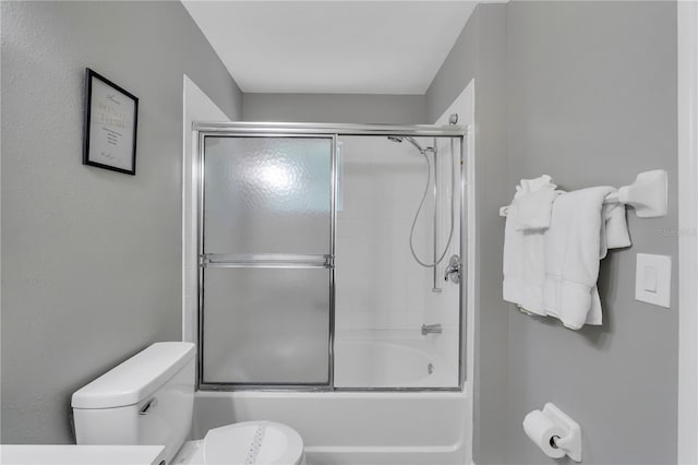 1129 Park Ridge Cir, Kissimmee, FL 34746 - full bathroom with toilet and shower / bath combination with glass door