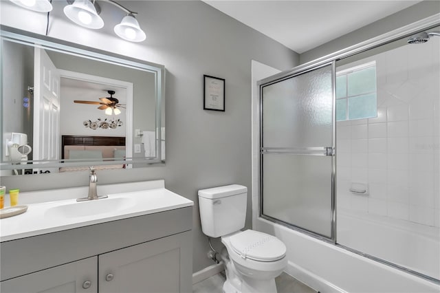 1129 Park Ridge Cir, Kissimmee, FL 34746 - bathroom featuring vanity, bath / shower combo with glass door, and a ceiling fan