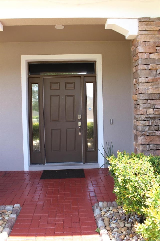 2805 Carter Grove Ln, Kissimmee, FL 34741 - view of exterior entry with stucco siding