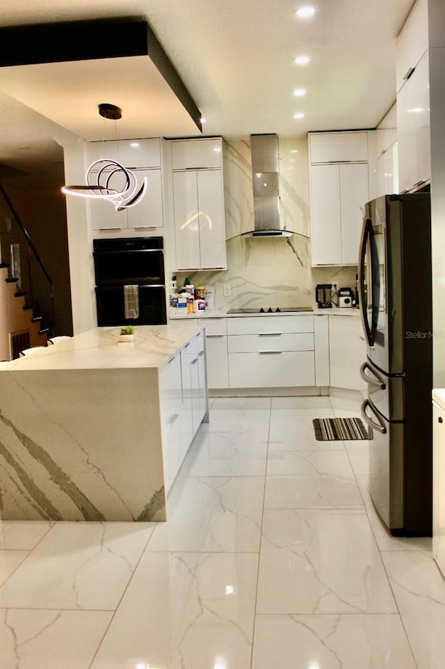 2805 Carter Grove Ln, Kissimmee, FL 34741 - kitchen featuring wall chimney range hood, modern cabinets, black appliances, and white cabinets