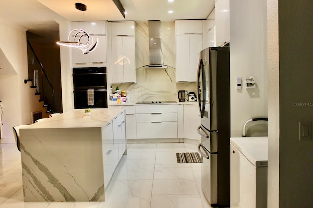 2805 Carter Grove Ln, Kissimmee, FL 34741 - kitchen with black appliances, wall chimney exhaust hood, modern cabinets, light marble finish flooring, and white cabinetry
