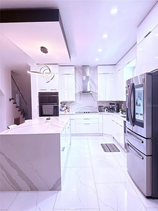 2805 Carter Grove Ln, Kissimmee, FL 34741 - kitchen featuring modern cabinets, wall chimney exhaust hood, black appliances, and recessed lighting