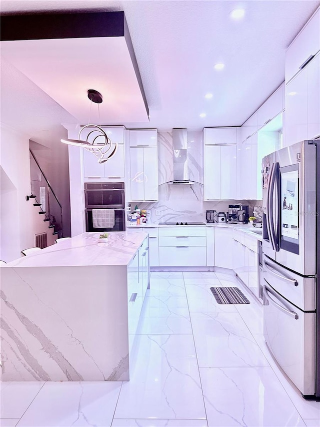 2805 Carter Grove Ln, Kissimmee, FL 34741 - kitchen with stainless steel refrigerator with ice dispenser, modern cabinets, wall chimney range hood, white cabinetry, and recessed lighting