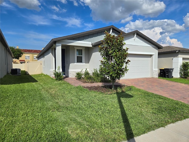 3839 Marbella Way, Davenport, FL 33897 - single story home featuring decorative driveway, a garage, stucco siding, and stone siding
