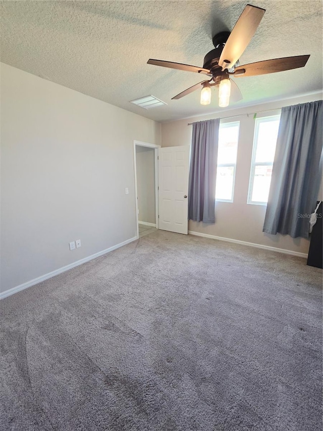 3839 Marbella Way, Davenport, FL 33897 - carpeted spare room featuring a ceiling fan and a textured ceiling