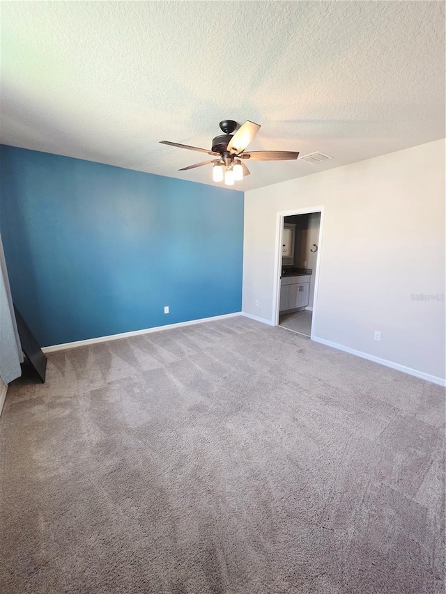 3839 Marbella Way, Davenport, FL 33897 - spare room featuring carpet, ceiling fan, and a textured ceiling