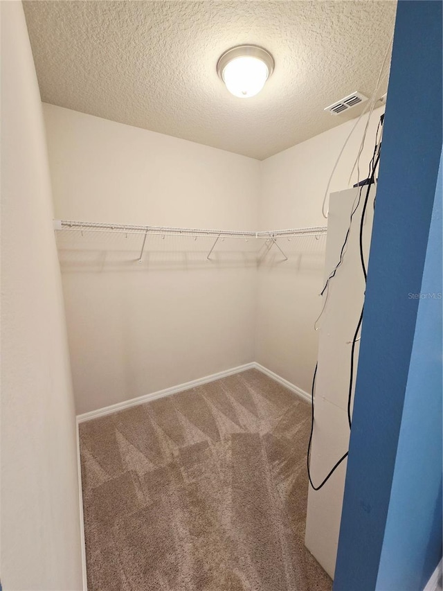 3839 Marbella Way, Davenport, FL 33897 - walk in closet featuring carpet