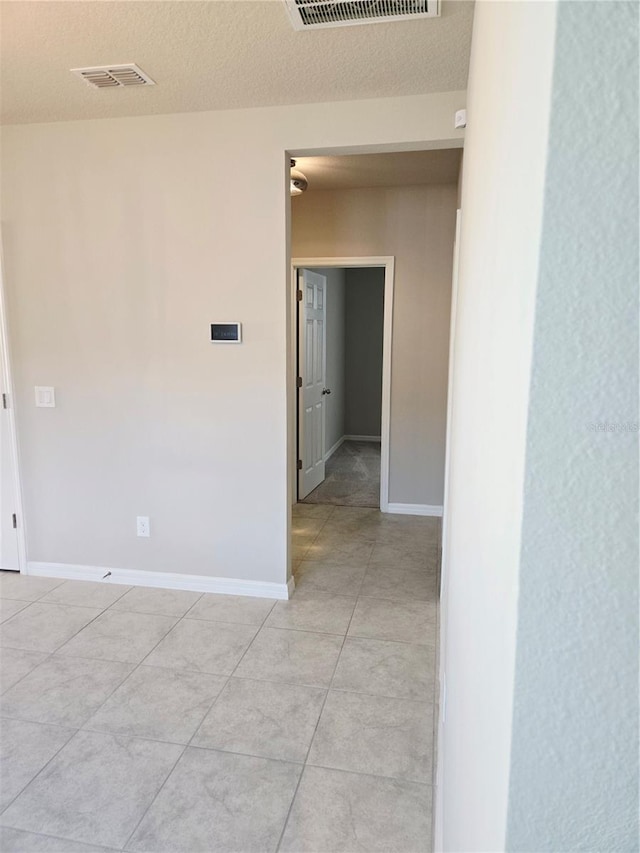 3839 Marbella Way, Davenport, FL 33897 - unfurnished room featuring light tile patterned floors and a textured ceiling