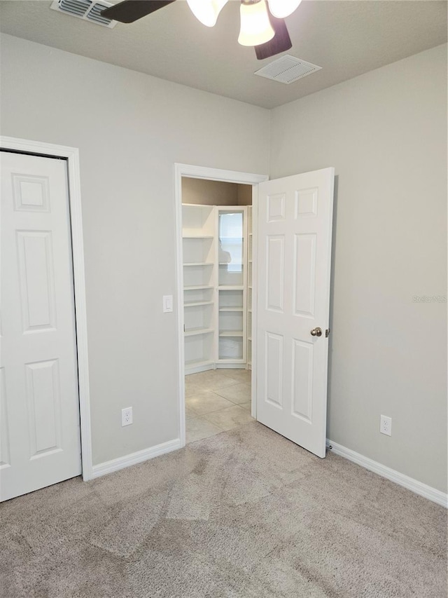 3839 Marbella Way, Davenport, FL 33897 - unfurnished bedroom featuring carpet, a closet, and ceiling fan