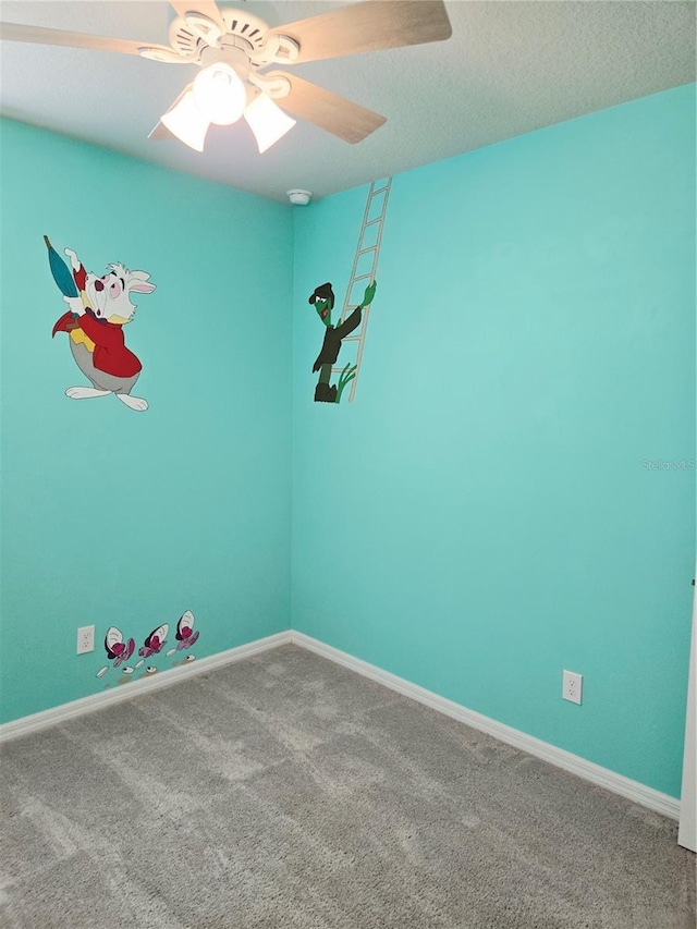 3839 Marbella Way, Davenport, FL 33897 - carpeted empty room with a ceiling fan and baseboards