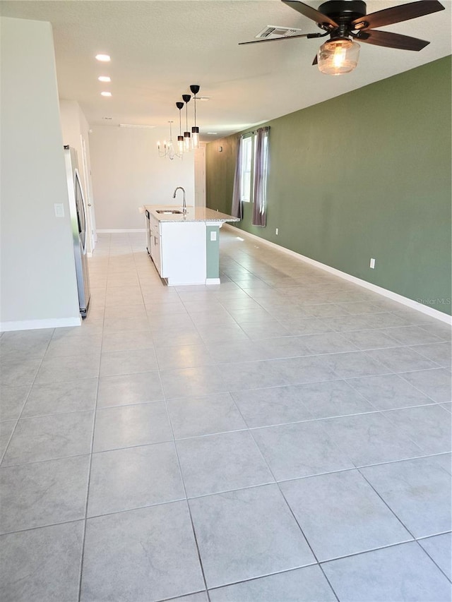 3839 Marbella Way, Davenport, FL 33897 - spare room with a ceiling fan, light tile patterned flooring, a chandelier, and recessed lighting