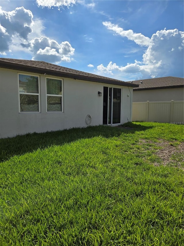 3839 Marbella Way, Davenport, FL 33897 - back of house with stucco siding