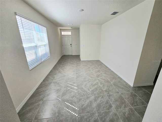 1370 Holodak Dr, Davenport, FL 33837 - tiled spare room featuring baseboards