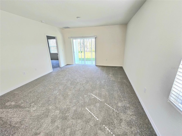 1370 Holodak Dr, Davenport, FL 33837 - empty room with carpet and plenty of natural light