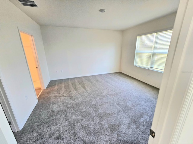 1370 Holodak Dr, Davenport, FL 33837 - carpeted empty room with baseboards and a textured ceiling