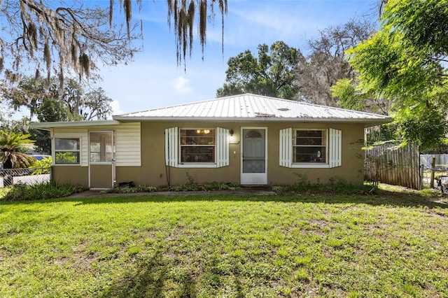 1101 Oregon Ave, Saint Cloud, FL 34769 - bungalow-style home featuring stucco siding and a metal roof