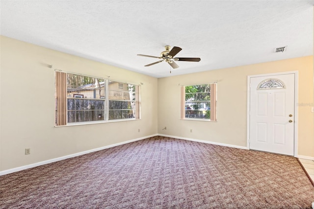 1101 Oregon Ave, Saint Cloud, FL 34769 - carpeted spare room featuring a ceiling fan and a textured ceiling