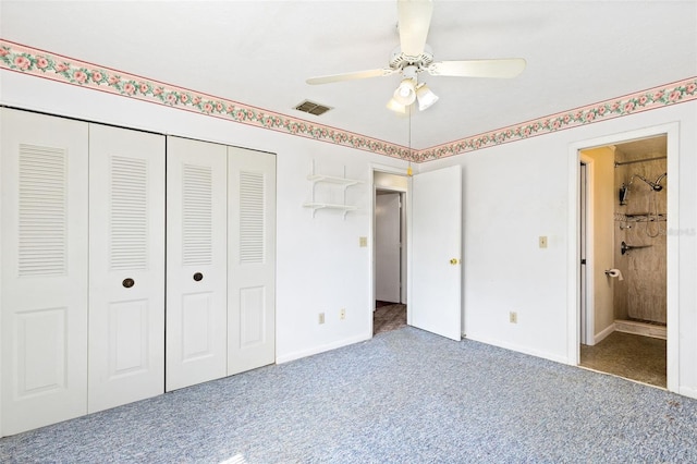 1101 Oregon Ave, Saint Cloud, FL 34769 - unfurnished bedroom with carpet, a closet, ceiling fan, and ensuite bathroom